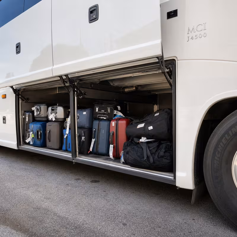 Party bus interior with wraparound leather seating and LED lighting in Fort Myers