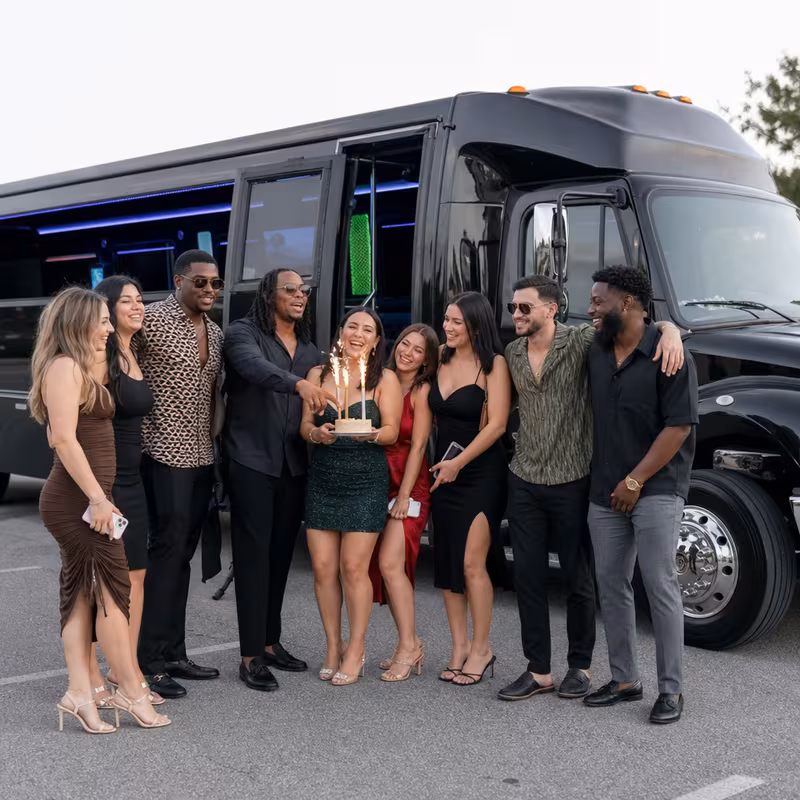 Group boarding a white charter bus for Birthday Transportation transportation in Fort Myers