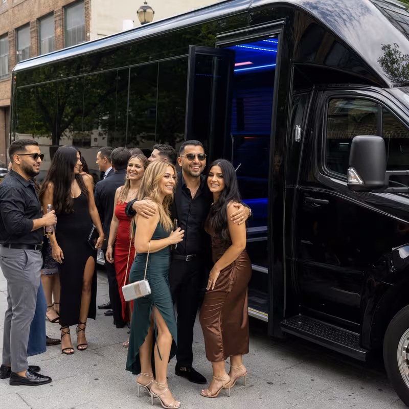 Passengers loading luggage while boarding an Fort Myers group shuttle