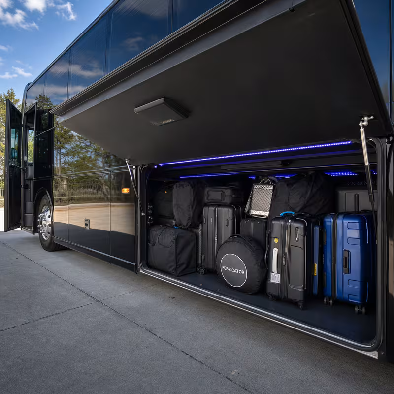 Party bus interior with wraparound leather seating and LED lighting in Fort Myers