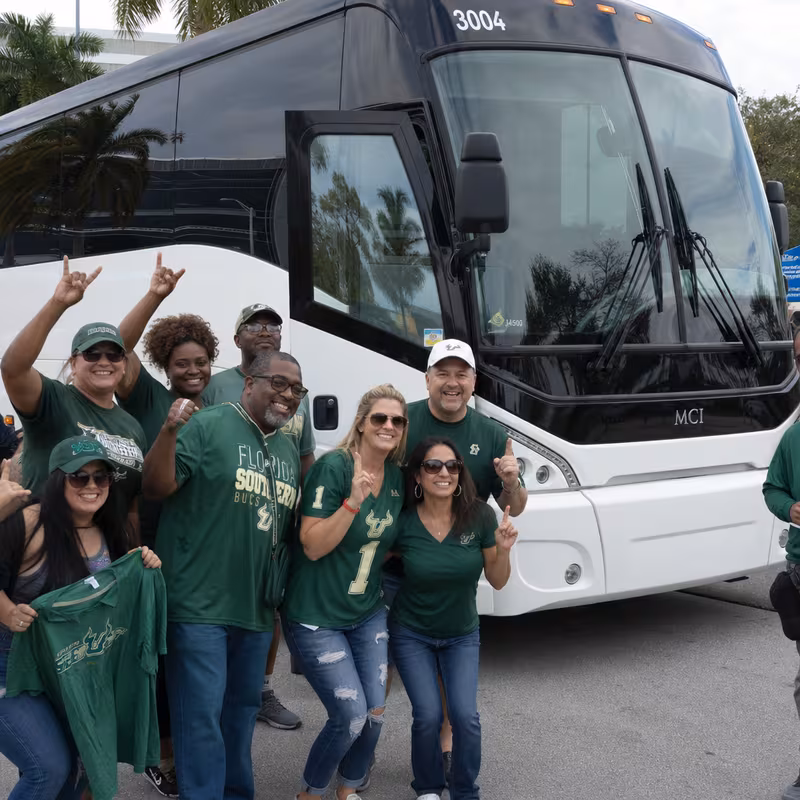 Passengers loading luggage while boarding an Fort Myers group shuttle