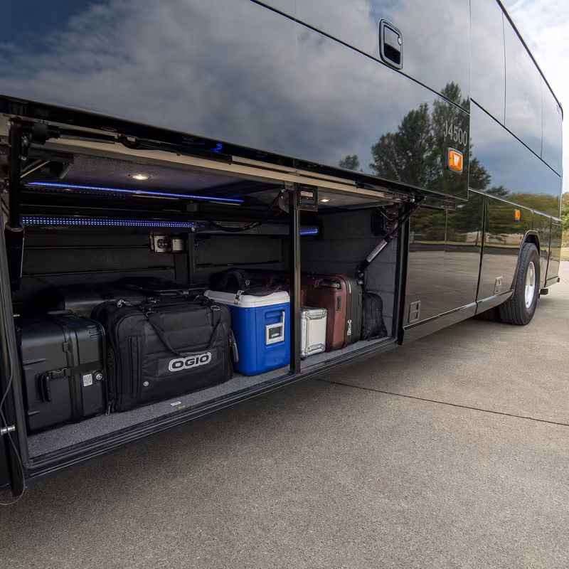 Party bus interior with wraparound leather seating and LED lighting in Fort Myers